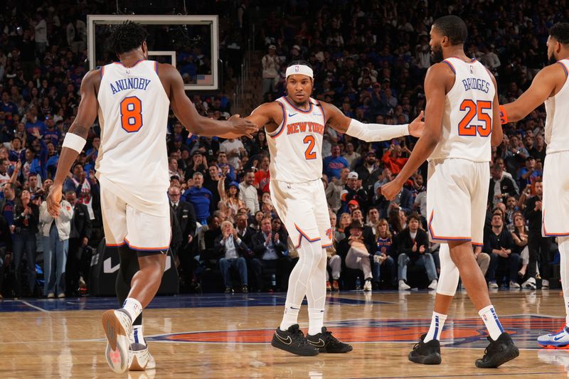 NEW YORK, NY - MAY 21:  OG Anunoby #8, Miles McBride #2 and Mikal Bridges #25 of the New York Knicks high fiive during the game against the Indiana Pacers  during Game 1 of the 2025 Eastern Conference Finals on May 21, 2025 at Madison Square Garden in New York City, New York.  NOTE TO USER: User expressly acknowledges and agrees that, by downloading and or using this photograph, User is consenting to the terms and conditions of the Getty Images License Agreement. Mandatory Copyright Notice: Copyright 2025 NBAE  (Photo by Jesse D. Garrabrant/NBAE via Getty Images)
