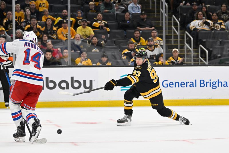 Oct 4, 2025; Boston, Massachusetts, USA; Boston Bruins center Fraser Minten (93) shoots the puck through the defense of New York Rangers right wing Taylor Raddysh (14) during the third period period at TD Garden. Mandatory Credit: Eric Canha-Imagn Images