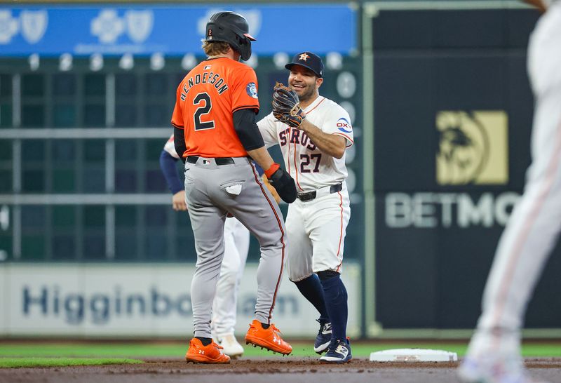 Jun 22, 2024; Houston, Texas, USA; Houston Astros second baseman Jose Altuve (27) smiles after tagging out Baltimore Orioles shortstop Gunnar Henderson (2) on a play during the first inning at Minute Maid Park. Mandatory Credit: Troy Taormina-USA TODAY Sports