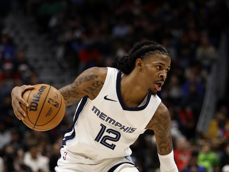 NEW ORLEANS, LOUISIANA - DECEMBER 19: Ja Morant #12 of the Memphis Grizzlies drives the ball up the court against the New Orleans Pelicans at Smoothie King Center on December 19, 2023 in New Orleans, Louisiana.  NOTE TO USER: User expressly acknowledges and agrees that, by downloading and or using this photograph, User is consenting to the terms and conditions of the Getty Images License Agreement. (Photo by Chris Graythen/Getty Images)