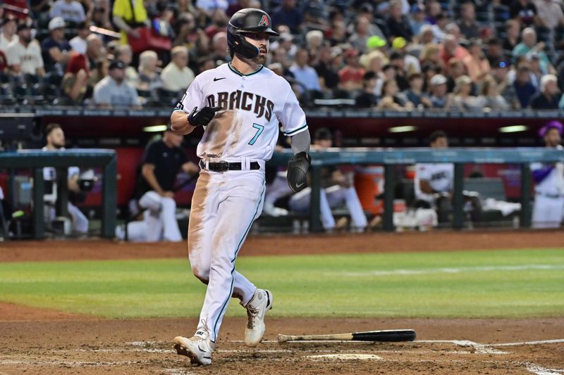 Sep 20, 2023; Phoenix, Arizona, USA;  Arizona Diamondbacks left fielder Corbin Carroll (7) scores in the third inning against the San Francisco Giants Kartozian-USA TODAY Sports