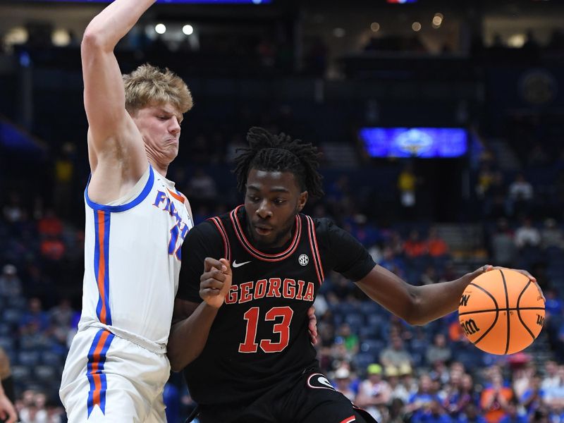 Mar 14, 2024; Nashville, TN, USA; Georgia Bulldogs forward Dylan James (13) drives to the basket against Florida Gators forward Thomas Haugh (10) during the second half at Bridgestone Arena. Mandatory Credit: Christopher Hanewinckel-USA TODAY Sports