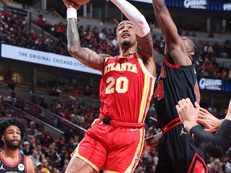 CHICAGO, IL - APRIL 4: John Collins #20 of the Atlanta Hawks drives to the basket during the game against the Chicago Bulls on April 4, 2023 at United Center in Chicago, Illinois. NOTE TO USER: User expressly acknowledges and agrees that, by downloading and or using this photograph, User is consenting to the terms and conditions of the Getty Images License Agreement. Mandatory Copyright Notice: Copyright 2023 NBAE (Photo by Jeff Haynes/NBAE via Getty Images)