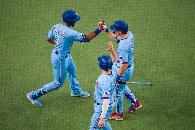 Sep 24, 2023; Arlington, Texas, USA; Texas Rangers center fielder Leody Taveras (3) and designated hitter Mitch Garver (18) and left fielder Evan Carter (32) celebrate after Taveras hits a two run home run against the Seattle Mariners during the fourth inning at Globe Life Field. Mandatory Credit: Jerome Miron-USA TODAY Sports