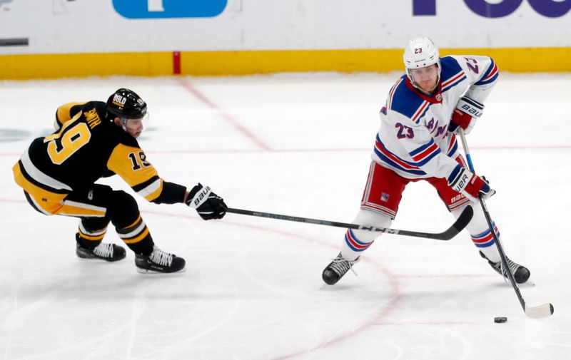 Mar 16, 2024; Pittsburgh, Pennsylvania, USA;  New York Rangers defenseman Adam Fox (23) moves the puck against Pittsburgh Penguins right wing Reilly Smith (19) during the third period at PPG Paints Arena. New York won 7-4. Mandatory Credit: Charles LeClaire-USA TODAY Sports