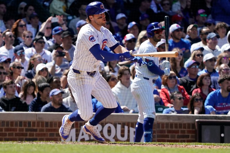 May 5, 2024; Chicago, Illinois, USA; Chicago Cubs second baseman Nico Hoerner (2) hits a two-run double against the Milwaukee Brewers during the fifth inning at Wrigley Field. Mandatory Credit: David Banks-USA TODAY Sports