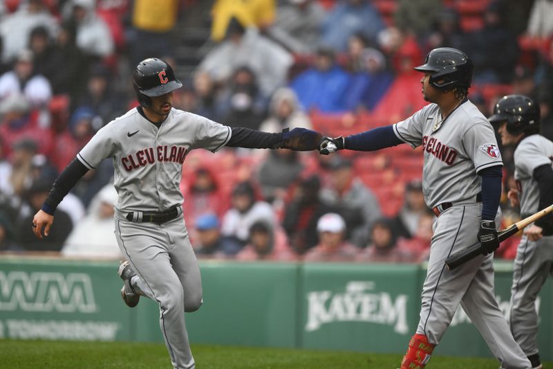 Apr 30, 2023; Boston, Massachusetts, USA; Cleveland Guardians third baseman Jose Ramirez (11) celebrates with left fielder Steven Kwan (38) after scoring a run against the Boston Red Sox during the sixth inning at Fenway Park. Mandatory Credit: Brian Fluharty-USA TODAY Sports