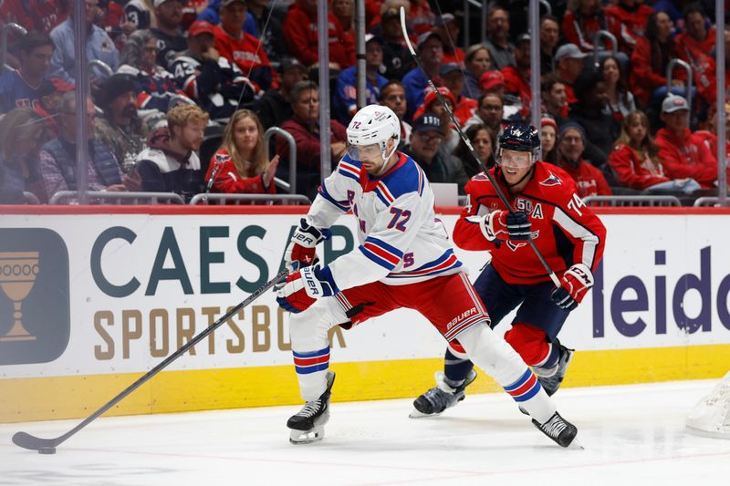 Oct 29, 2024; Washington, District of Columbia, USA; New York Rangers center Filip Chytil (72) skates with the puck as Washington Capitals defenseman John Carlson (74) chases in the second period at Capital One Arena. Mandatory Credit: Geoff Burke-Imagn Images