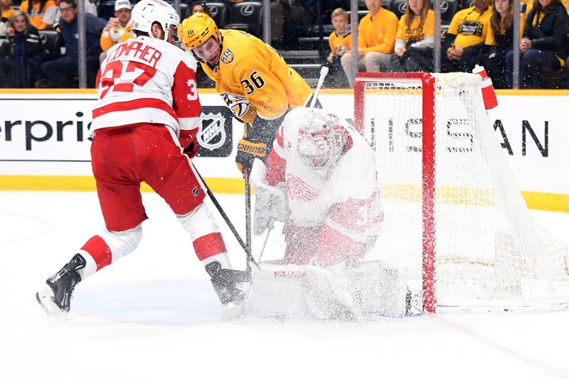 Mar 23, 2024; Nashville, Tennessee, USA; Detroit Red Wings goaltender Alex Lyon (34) makes a save on a play by Nashville Predators left wing Cole Smith (36) during the third period at Bridgestone Arena. Mandatory Credit: Christopher Hanewinckel-USA TODAY Sports