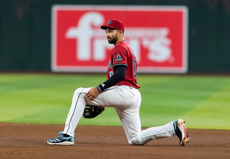May 28, 2025; Phoenix, Arizona, USA; Arizona Diamondbacks second baseman Jordan Lawlar reacts after make a throwing error in the sixth inning against the Pittsburgh Pirates at Chase Field. Mandatory Credit: Mark J. Rebilas-Imagn Images