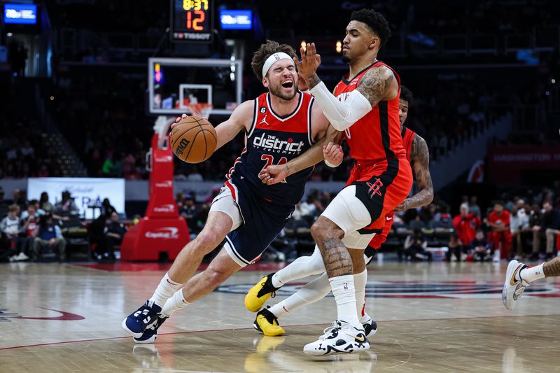 WASHINGTON, DC - APRIL 09: Corey Kispert #24 of the Washington Wizards drives to the basket against Kenyon Martin Jr. #6 of the Houston Rockets  during the second half at Capital One Arena on April 9, 2023 in Washington, DC. NOTE TO USER: User expressly acknowledges and agrees that, by downloading and or using this photograph, User is consenting to the terms and conditions of the Getty Images License Agreement. (Photo by Scott Taetsch/Getty Images)