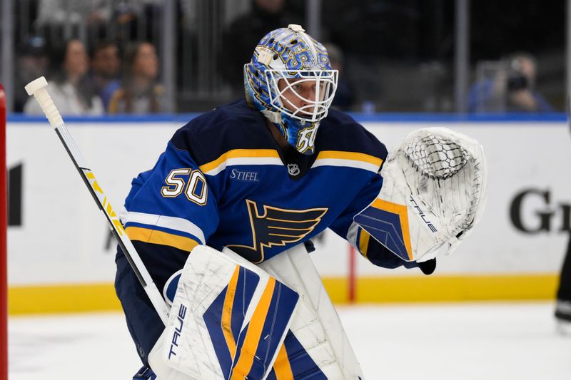 Oct 22, 2024; St. Louis, Missouri, USA; St. Louis Blues goaltender Jordan Binnington (50) looks on during the first period against the Winnipeg Jets at Enterprise Center. Mandatory Credit: Jeff Le-Imagn Images 