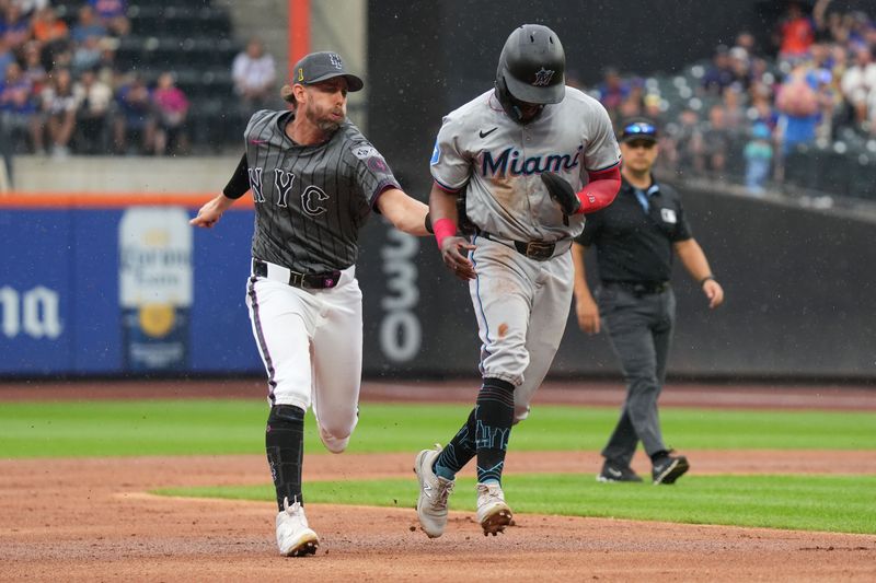 Aug 17, 2024; New York City, New York, USA; New York Mets second baseman Jeff McNeil (1) tags out Miami Marlins second baseman Vidal Brujan (17) after catching him in a pickle during the third inning at Citi Field. Mandatory Credit: Lucas Boland-USA TODAY Sports