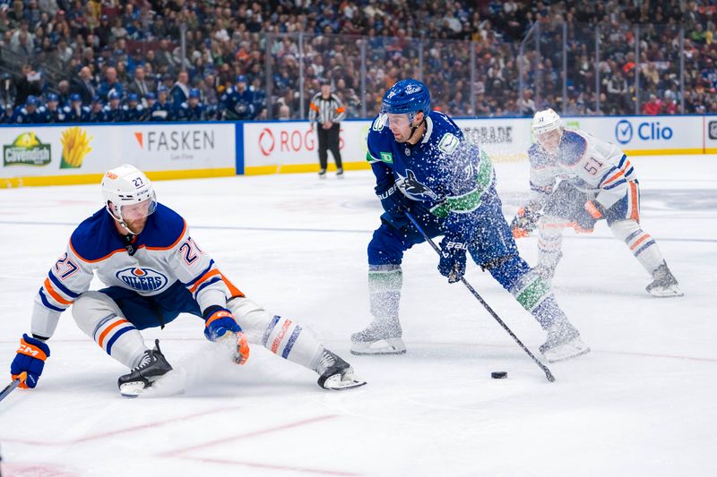 Oct 4, 2024; Vancouver, British Columbia, CAN; Edmonton Oilers defenseman Brett Kulak (27) goes down to block a shot taken by Vancouver Canucks forward Nils Hoglander (21) during the third period at Rogers Arena. Mandatory Credit: Bob Frid-Imagn Images