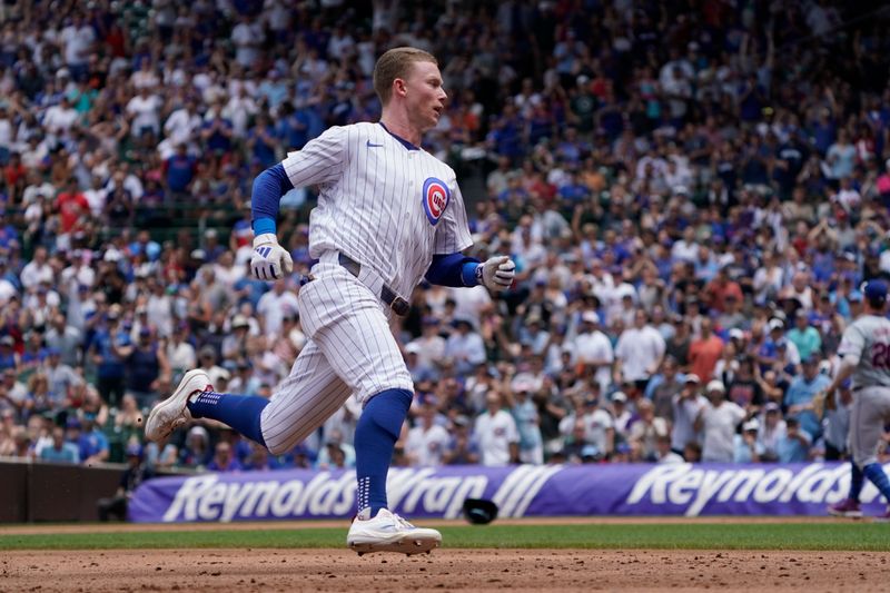 Jun 22, 2024; Chicago, Illinois, USA; Chicago Cubs outfielder Pete Crow-Armstrong (52) runs the bases after hitting an RBI triple against the New York Mets during the first inning at Wrigley Field. Mandatory Credit: David Banks-USA TODAY Sports