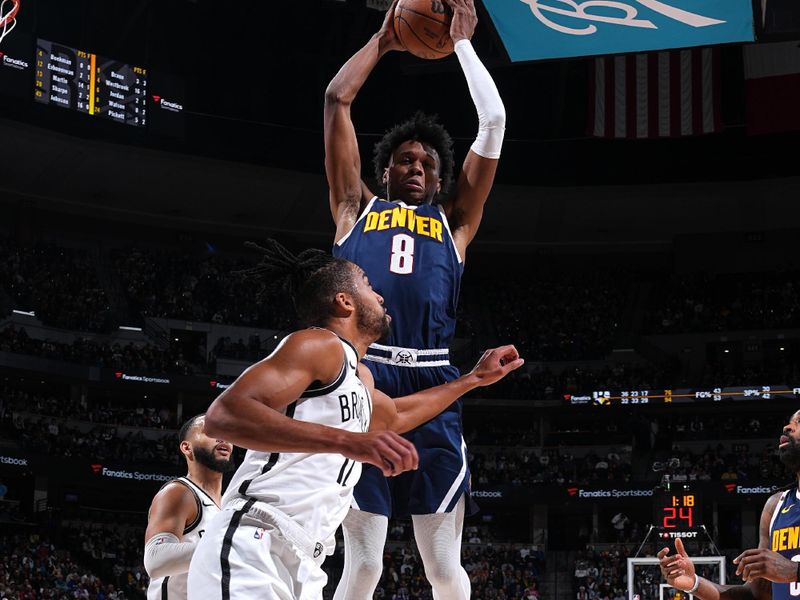 DENVER, CO - JANUARY 10: Peyton Watson #8 of the Denver Nuggets rebounds the ball during the game against the Brooklyn Nets on January 10, 2025 at Ball Arena in Denver, Colorado. NOTE TO USER: User expressly acknowledges and agrees that, by downloading and/or using this Photograph, user is consenting to the terms and conditions of the Getty Images License Agreement. Mandatory Copyright Notice: Copyright 2025 NBAE (Photo by Garrett Ellwood/NBAE via Getty Images)