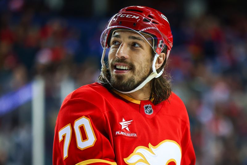 Sep 28, 2024; Calgary, Alberta, CAN; Calgary Flames left wing Ryan Lomberg (70) reacts during the first period against the Vancouver Canucks at Scotiabank Saddledome. Mandatory Credit: Sergei Belski-Imagn Images