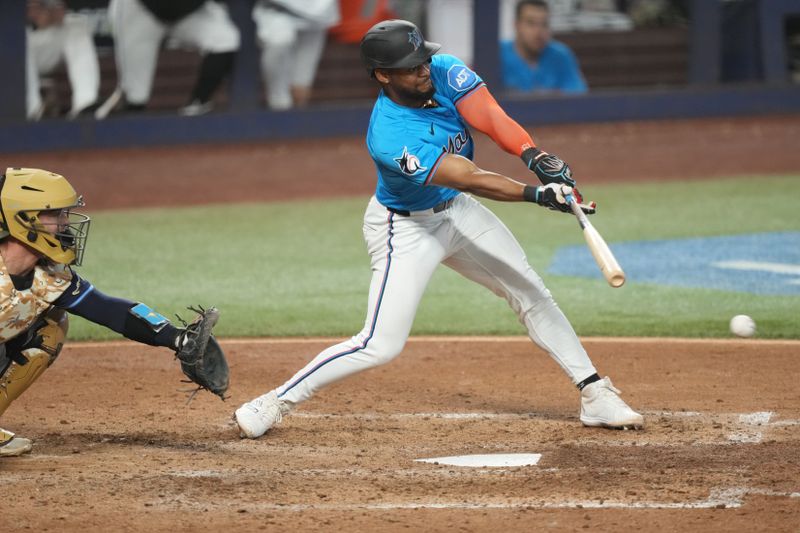 May 18, 2025; Miami, Florida, USA;  Miami Marlins second baseman Otto Lopez (6) grounds out in the sixth inning against the Tampa Bay Rays at loanDepot Park. Mandatory Credit: Jim Rassol-Imagn Images
