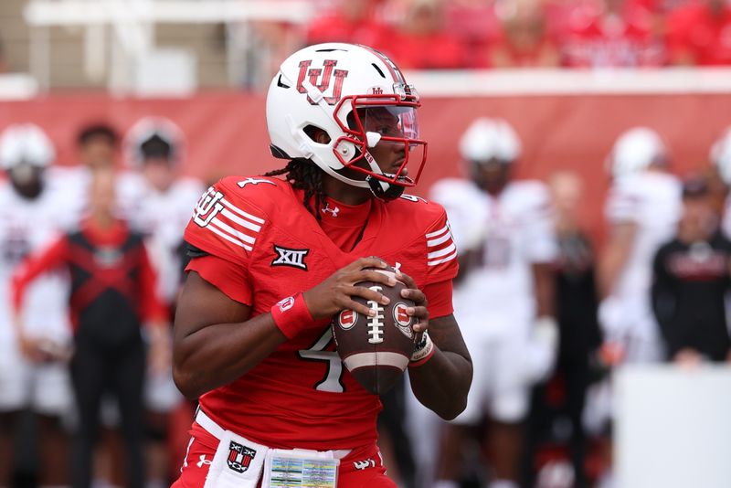 Sep 20, 2025; Salt Lake City, Utah, USA; Utah Utes quarterback Devon Dampier (4) looks to pass against the Texas Tech Red Raiders during the first quarter at Rice-Eccles Stadium. Mandatory Credit: Rob Gray-Imagn Images