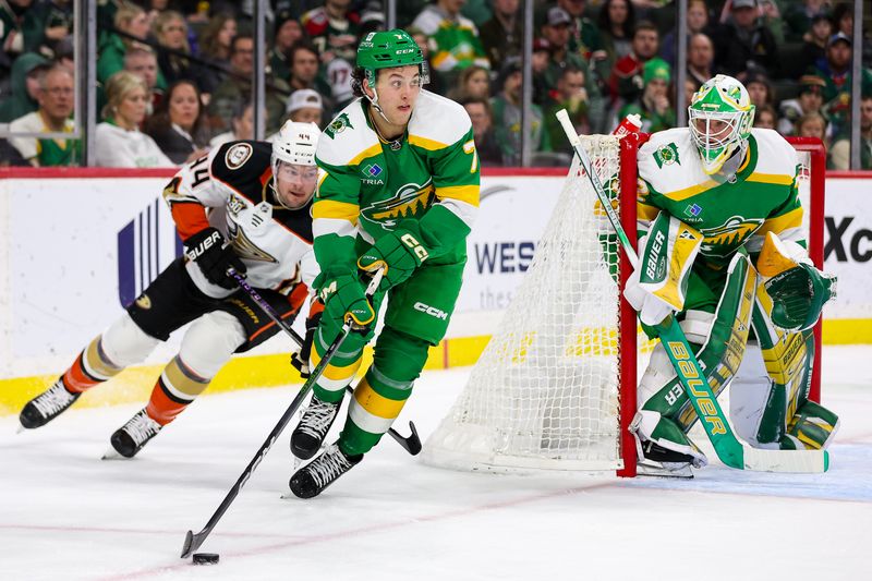 Jan 27, 2024; Saint Paul, Minnesota, USA; Minnesota Wild defenseman Brock Faber (7) and Anaheim Ducks left wing Ross Johnston (44) compete for the puck as goaltender Filip Gustavsson (32) defends his net during the second period at Xcel Energy Center. Mandatory Credit: Matt Krohn-USA TODAY Sports