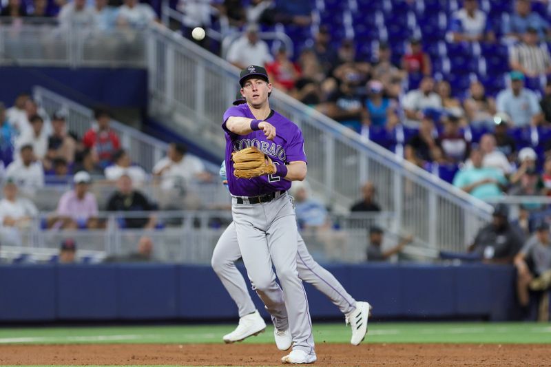 Jul 22, 2023; Miami, Florida, USA; Colorado Rockies third baseman Ryan McMahon (24) throws the ball to first  retiring Miami Marlins catcher Jacob Stallings (not pictured) during the second inning at loanDepot Park. Mandatory Credit: Sam Navarro-USA TODAY Sports