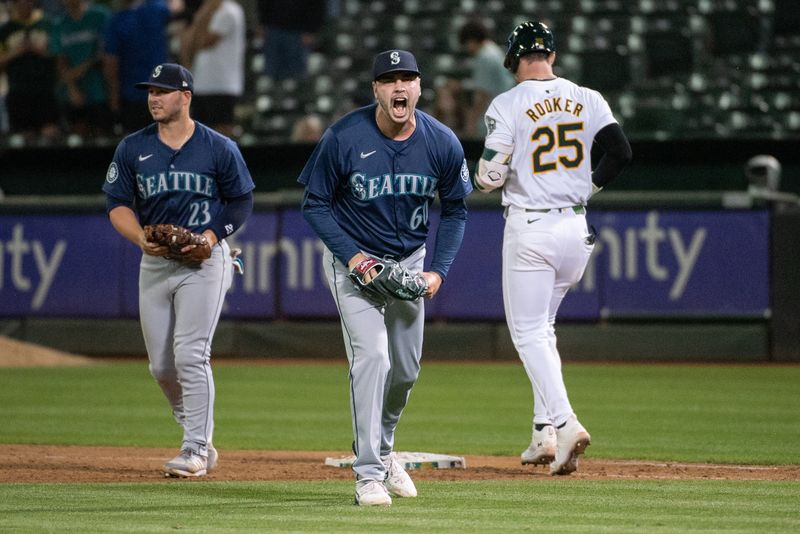 Jun 4, 2024; Oakland, California, USA; Seattle Mariners pitcher Tayler Saucedo (60) reacts after making the final out against the Oakland Athletics at Oakland-Alameda County Coliseum. Mandatory Credit: Ed Szczepanski-USA TODAY Sports