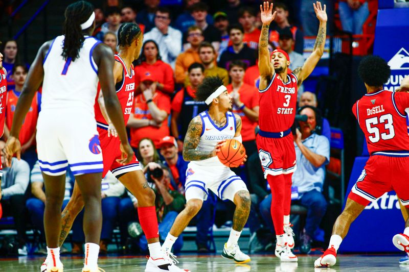 Feb 17, 2024; Boise, Idaho, USA; Boise State Broncos guard Roddie Anderson III (0) works against Fresno State Bulldogs guard Isaiah Hill (3) during the first half at ExtraMile Arena. Mandatory Credit: Brian Losness-USA TODAY Sports
