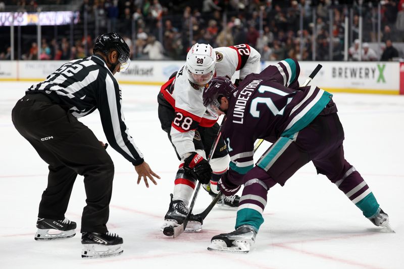 Mar 6, 2024; Anaheim, California, USA;  Ottawa Senators right wing Claude Giroux (28) and Anaheim Ducks center Isac Lundestrom (21) face off during the third period at Honda Center. Mandatory Credit: Kiyoshi Mio-USA TODAY Sports