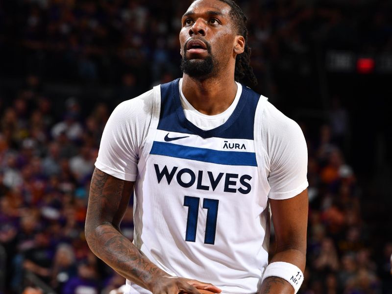 PHOENIX, AZ - APRIL 26:  Naz Reid #11 of the Minnesota Timberwolves shoots a free throw during the game against the Phoenix Suns during Round 1 Game 3 of the 2024 NBA Playoffs on April 26, 2024 at Footprint Center in Phoenix, Arizona. NOTE TO USER: User expressly acknowledges and agrees that, by downloading and or using this photograph, user is consenting to the terms and conditions of the Getty Images License Agreement. Mandatory Copyright Notice: Copyright 2024 NBAE (Photo by Barry Gossage/NBAE via Getty Images)