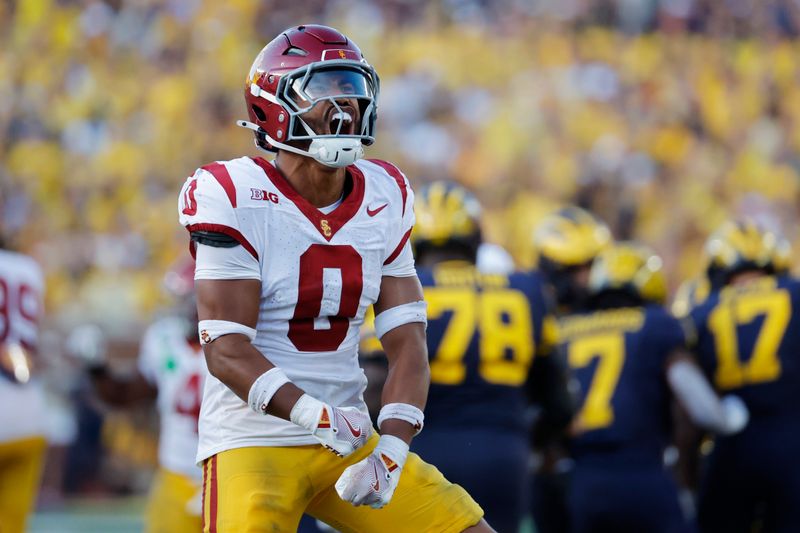 Sep 21, 2024; Ann Arbor, Michigan, USA;  USC Trojans safety Akili Arnold (0) celebrates in the second half against the Michigan Wolverines at Michigan Stadium. Mandatory Credit: Rick Osentoski-Imagn Images