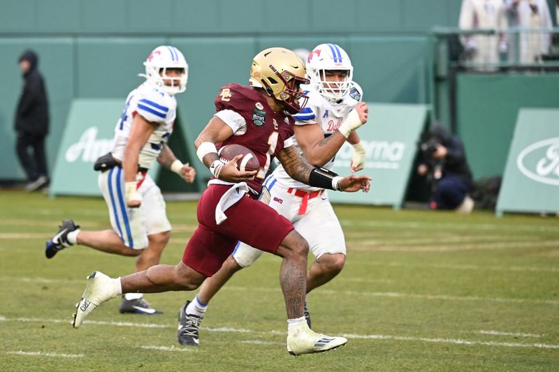 Dec 28, 2023; Boston, MA, USA; Boston College Eagles quarterback Thomas Castellanos (1) runs for a touchdown during the second half against the Southern Methodist Mustangsat Fenway Park. Mandatory Credit: Eric Canha-USA TODAY Sports