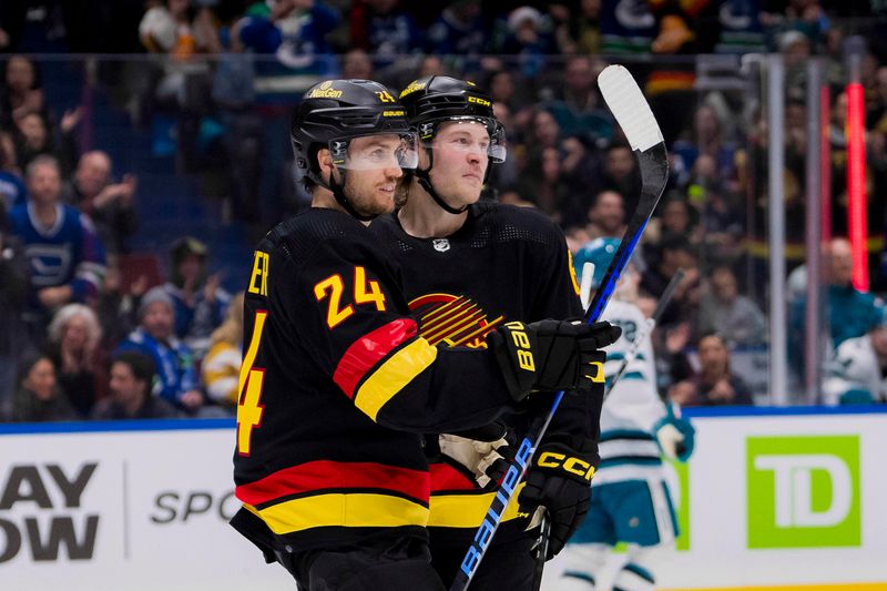 Dec 23, 2023; Vancouver, British Columbia, CAN; Vancouver Canucks forward Pius Suter (24) and forward Brock Boeser (6) celebrate Suter   s goal against the San Jose Sharks in the third period at Rogers Arena. Canucks won 7-4. Mandatory Credit: Bob Frid-USA TODAY Sports