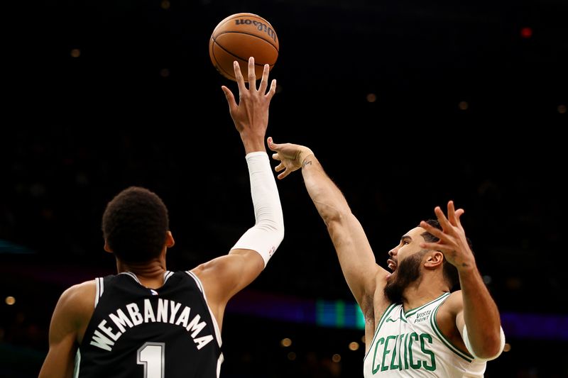 BOSTON, MASSACHUSETTS - JANUARY 17: Victor Wembanyama #1 of the San Antonio Spurs blocks a shot from Jayson Tatum #0 of the Boston Celtics at TD Garden on January 17, 2024 in Boston, Massachusetts. NOTE TO USER: User expressly acknowledges and agrees that, by downloading and or using this photograph, user is consenting to the terms and conditions of the Getty Images License Agreement.  (Photo by Maddie Meyer/Getty Images)