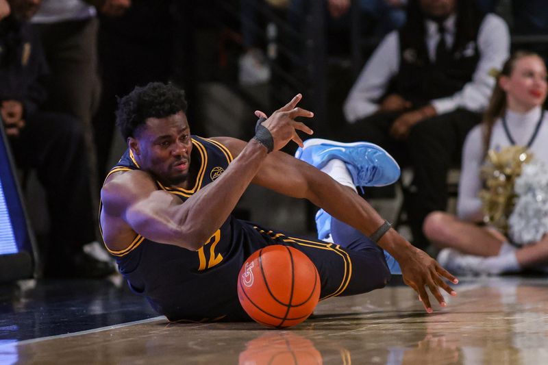 Feb 15, 2025; Atlanta, Georgia, USA; California Golden Bears center Mady Sissoko (12) dives for a loose ball against the Georgia Tech Yellow Jackets in the second half at McCamish Pavilion. Mandatory Credit: Brett Davis-Imagn Images