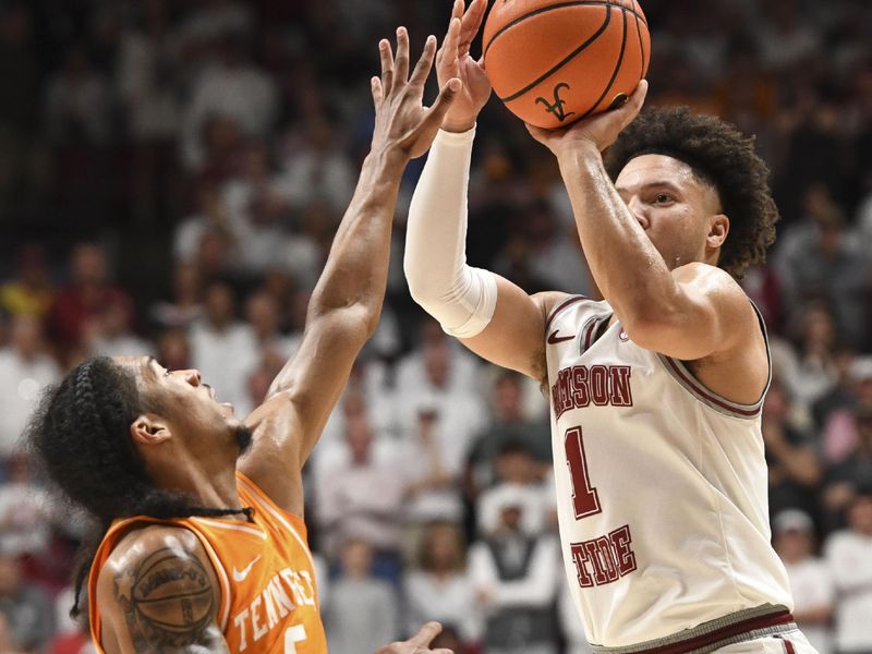 Mar 2, 2024; Tuscaloosa, Alabama, USA;  Tennessee guard Zakai Zeigler (5) defends a shot by Alabama guard Mark Sears (1) at Coleman Coliseum. Mandatory Credit: Gary Cosby Jr.-USA TODAY Sports