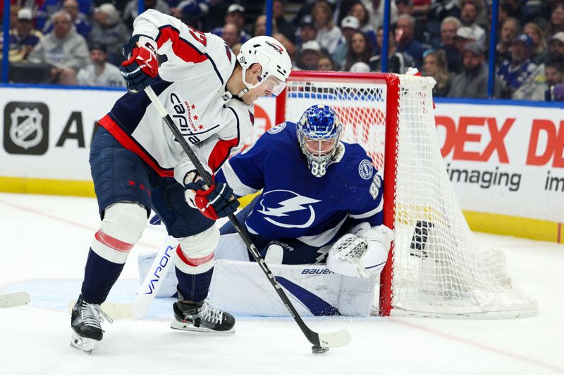 Feb 22, 2024; Tampa, Florida, USA;  Washington Capitals left wing Beck Malenstyn (47) controls the puck in front of the goal against the Tampa Bay Lightning in the second period at Amalie Arena. Mandatory Credit: Nathan Ray Seebeck-USA TODAY Sports