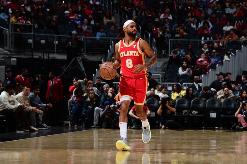 ATLANTA, GA - JANUARY 28: Patty Mills #8 of the Atlanta Hawks dribbles the ball during the game against the Toronto Raptors on January 28, 2024 at State Farm Arena in Atlanta, Georgia.  NOTE TO USER: User expressly acknowledges and agrees that, by downloading and/or using this Photograph, user is consenting to the terms and conditions of the Getty Images License Agreement. Mandatory Copyright Notice: Copyright 2024 NBAE (Photo by Scott Cunningham/NBAE via Getty Images)