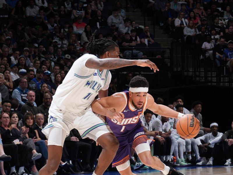 MINNEAPOLIS, MN -  APRIL 14: Devin Booker #1 of the Phoenix Suns handles the ball during the game against the Minnesota Timberwolves on April 14, 2024 at Target Center in Minneapolis, Minnesota. NOTE TO USER: User expressly acknowledges and agrees that, by downloading and or using this Photograph, user is consenting to the terms and conditions of the Getty Images License Agreement. Mandatory Copyright Notice: Copyright 2024 NBAE (Photo by Jordan Johnson/NBAE via Getty Images)