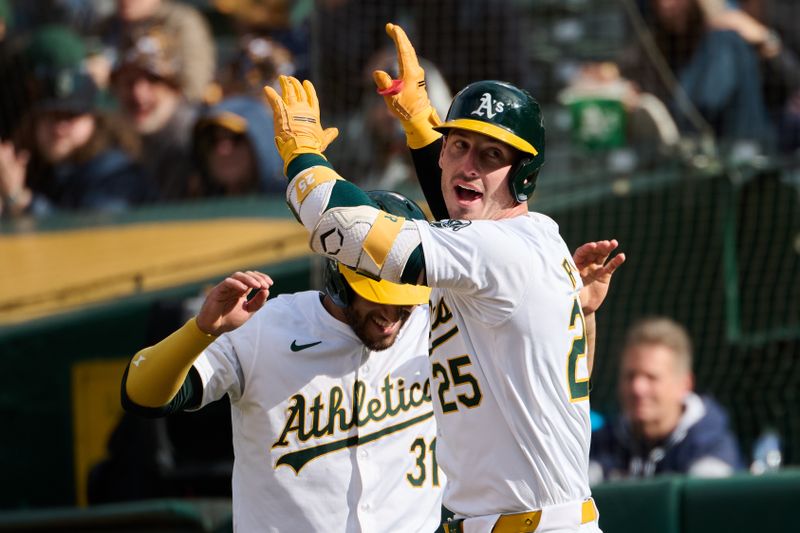 May 4, 2024; Oakland, California, USA; Oakland Athletics designated hitter Brent Rooker (25) celebrates with infielder Abraham Toro (31) after hitting his second home run of the third inning against the Miami Marlins at Oakland-Alameda County Coliseum. Mandatory Credit: Robert Edwards-USA TODAY Sports