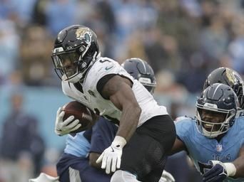 Jacksonville Jaguars running back Tank Bigsby (4) runs with the ball during the second half of an NFL football game against the Tennessee Titans, Sunday, Dec. 8, 2024, in Nashville, Tenn. (AP Photo/Stew Milne)