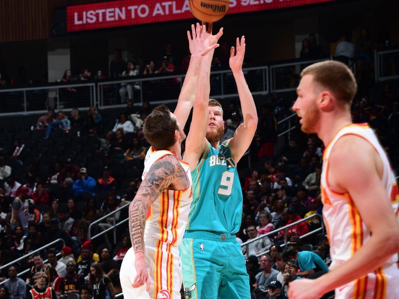 ATLANTA, GA - MARCH 23: Davis Bertans #9 of the Charlotte Hornets shoots the ball during the game against the Atlanta Hawks on March 23, 2024 at State Farm Arena in Atlanta, Georgia.  NOTE TO USER: User expressly acknowledges and agrees that, by downloading and/or using this Photograph, user is consenting to the terms and conditions of the Getty Images License Agreement. Mandatory Copyright Notice: Copyright 2024 NBAE (Photo by Scott Cunningham/NBAE via Getty Images)