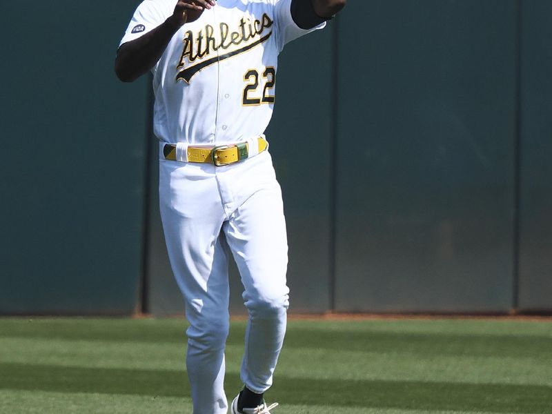 Sep 20, 2023; Oakland, California, USA; Oakland Athletics center fielder Lawrence Butler (22) catches the ball against the Seattle Mariners during the fifth inning at Oakland-Alameda County Coliseum. Mandatory Credit: Kelley L Cox-USA TODAY Sports