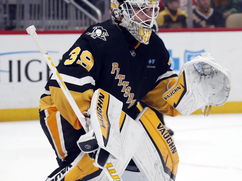 Apr 11, 2024; Pittsburgh, Pennsylvania, USA; Pittsburgh Penguins goaltender Alex Nedeljkovic (39) guards the net against the Detroit Red Wings during the second period at PPG Paints Arena. Pittsburgh won 6-5 in overtime. Mandatory Credit: Charles LeClaire-USA TODAY Sports