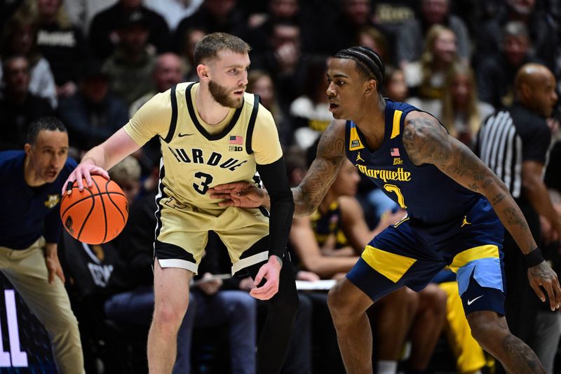 Dec 13, 2025; West Lafayette, Indiana, USA; Purdue Boilermakers guard Braden Smith (3) dribbles against Marquette Golden Eagles guard Zaide Lowery (7) during the first half at Mackey Arena. Mandatory Credit: Marc Lebryk-Imagn Images