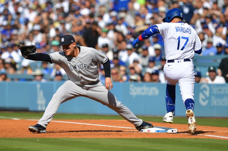 Jun 4, 2023; Los Angeles, California, USA; New York Yankees first baseman Anthony Rizzo (48) tags first for the out against Los Angeles Dodgers second baseman Miguel Vargas (17) during the second inning at Dodger Stadium. Mandatory Credit: Gary A. Vasquez-USA TODAY Sports