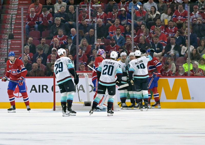 Oct 14, 2025; Montreal, Quebec, CAN; Seattle Kraken forward Jaden Schwartz (17) celebrates with teammates after scoring a goal against Montreal Canadiens goalie Sam Montembeault (35) during the second period at the Bell Centre. Mandatory Credit: Eric Bolte-Imagn Images