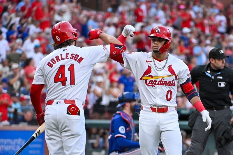Jul 30, 2024; St. Louis, Missouri, USA;  St. Louis Cardinals shortstop Masyn Winn (0) is congratulated by left fielder Alec Burleson (41) after hitting a solo home run against the Texas Rangers during the first inning at Busch Stadium. Mandatory Credit: Jeff Curry-USA TODAY Sports