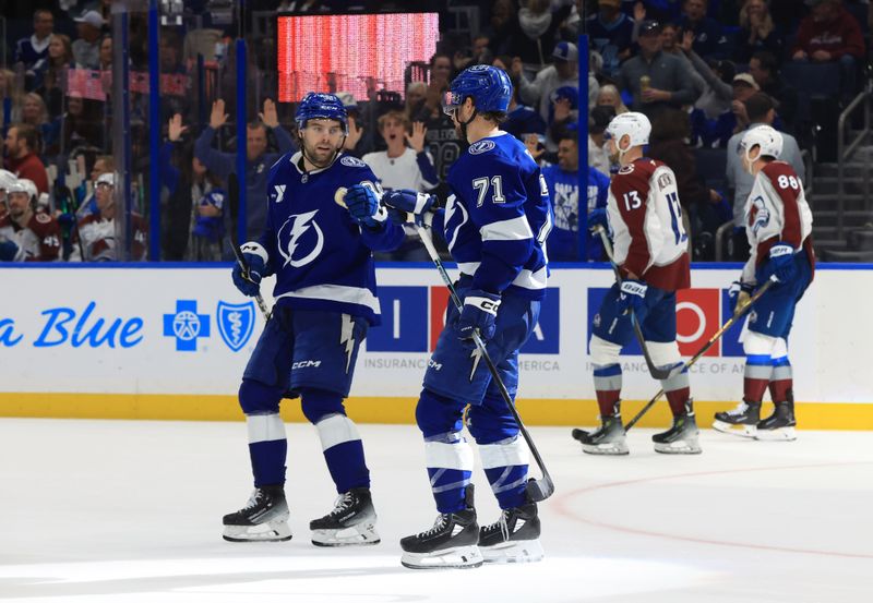 Jan 6, 2026; Tampa, Florida, USA; Tampa Bay Lightning center Anthony Cirelli (71) is congratulated after he scored an empty net goal against the Colorado Avalanche during the third period at Benchmark International Arena. Mandatory Credit: Kim Klement Neitzel-Imagn Images