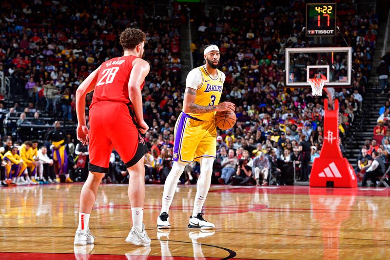 HOUSTON, TX - JANUARY 29:  Anthony Davis #3 of the Los Angeles Lakers handles the ball during the game against the Houston Rockets on January 29, 2024 at the Toyota Center in Houston, Texas. NOTE TO USER: User expressly acknowledges and agrees that, by downloading and or using this photograph, User is consenting to the terms and conditions of the Getty Images License Agreement. Mandatory Copyright Notice: Copyright 2024 NBAE (Photo by Logan Riely/NBAE via Getty Images)