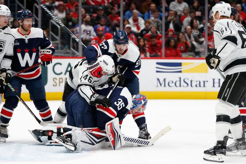 Jan 7, 2024; Washington, District of Columbia, USA; Washington Capitals goaltender Darcy Kuemper (35) makes a save in front of Los Angeles Kings center Blake Lizotte (46) and Capitals defenseman Trevor van Riemsdyk (57) during the first period at Capital One Arena. Mandatory Credit: Amber Searls-USA TODAY Sports